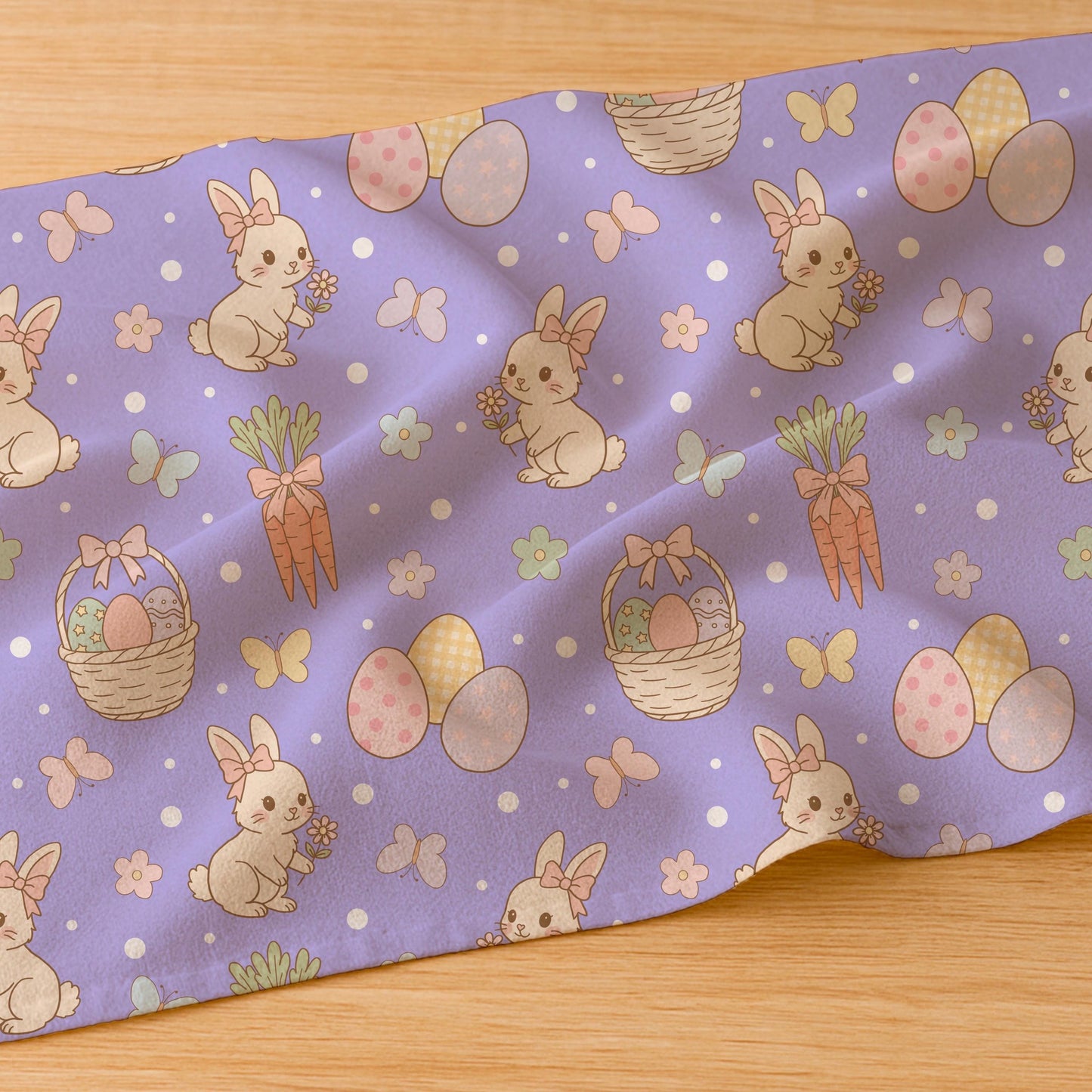 Fabric mockup showing the Easter bunny and carrot seamless pattern printed on soft white textile.