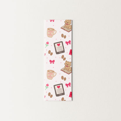 Decorative bookmark with cats and coffee cup designs on a white background