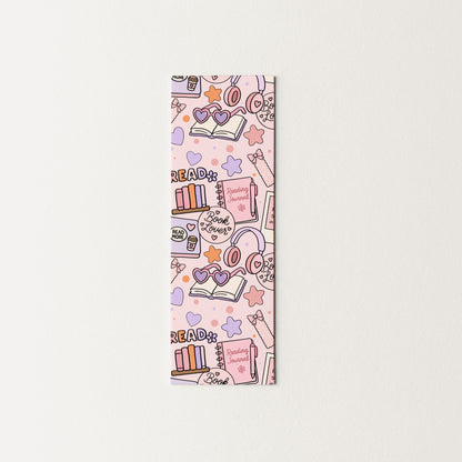 Colorful bookmark with book-themed illustrations on a white background