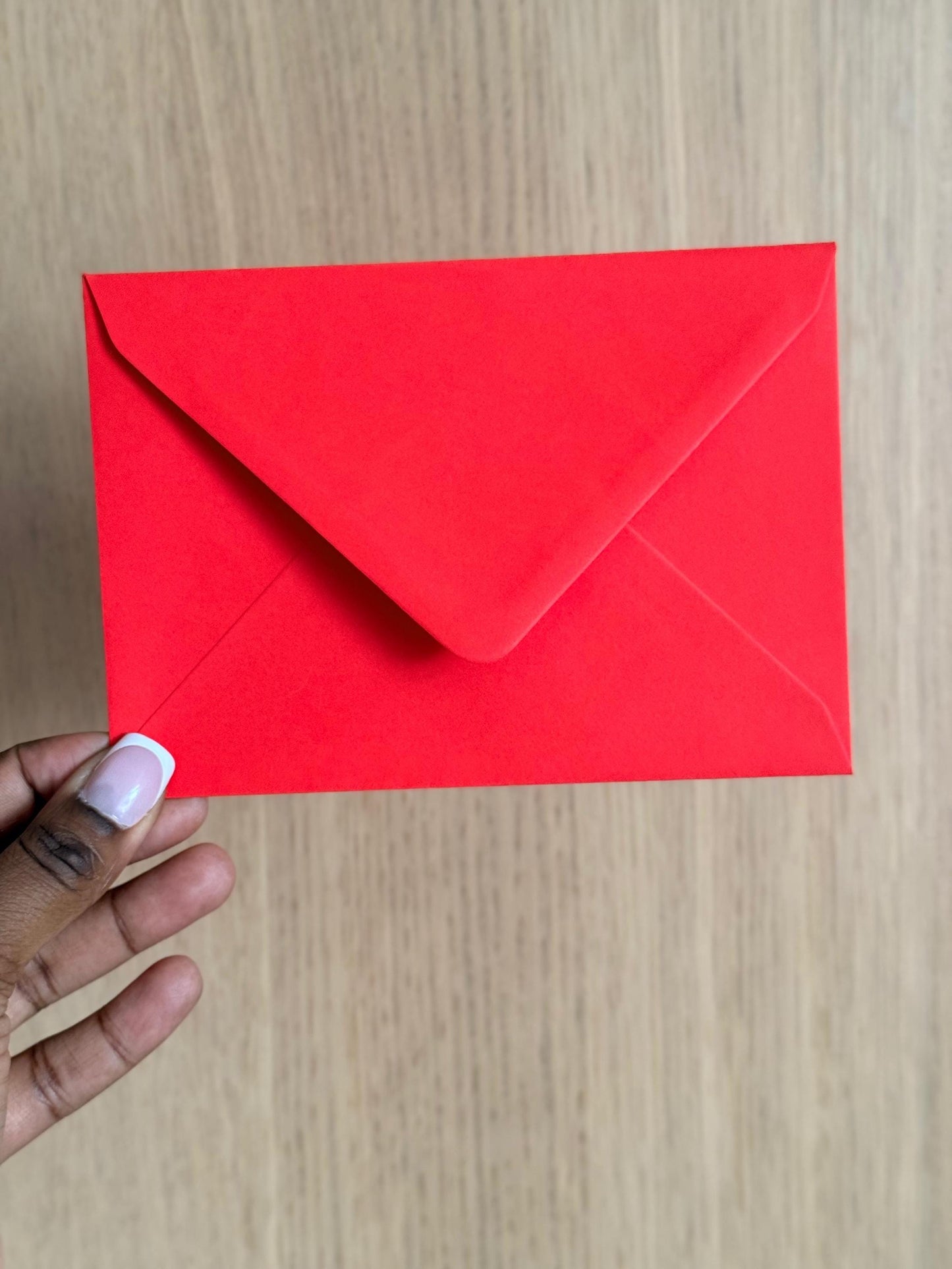 matching red envelope in hand