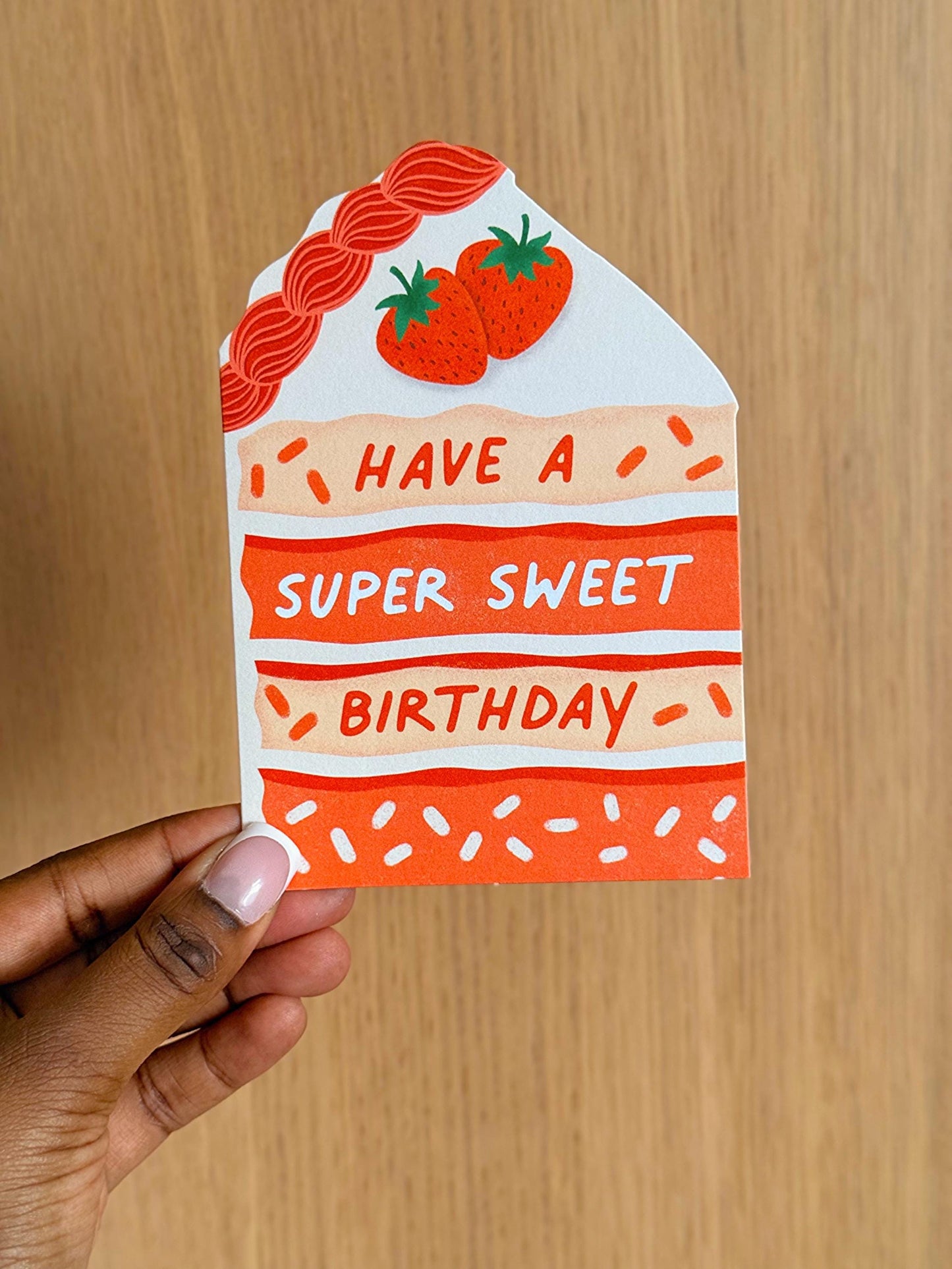 strawberry cake birthday card in hand