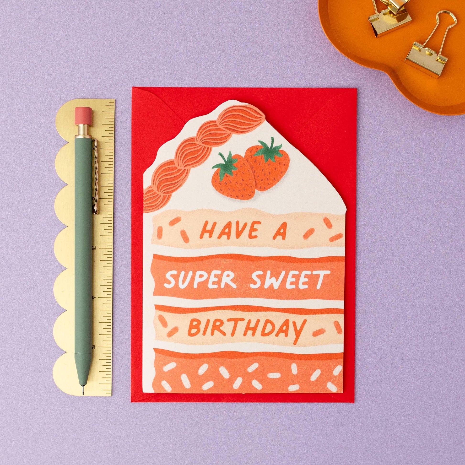 strawberry cake birthday card with matching red envelope flat Kay with pen and ruler